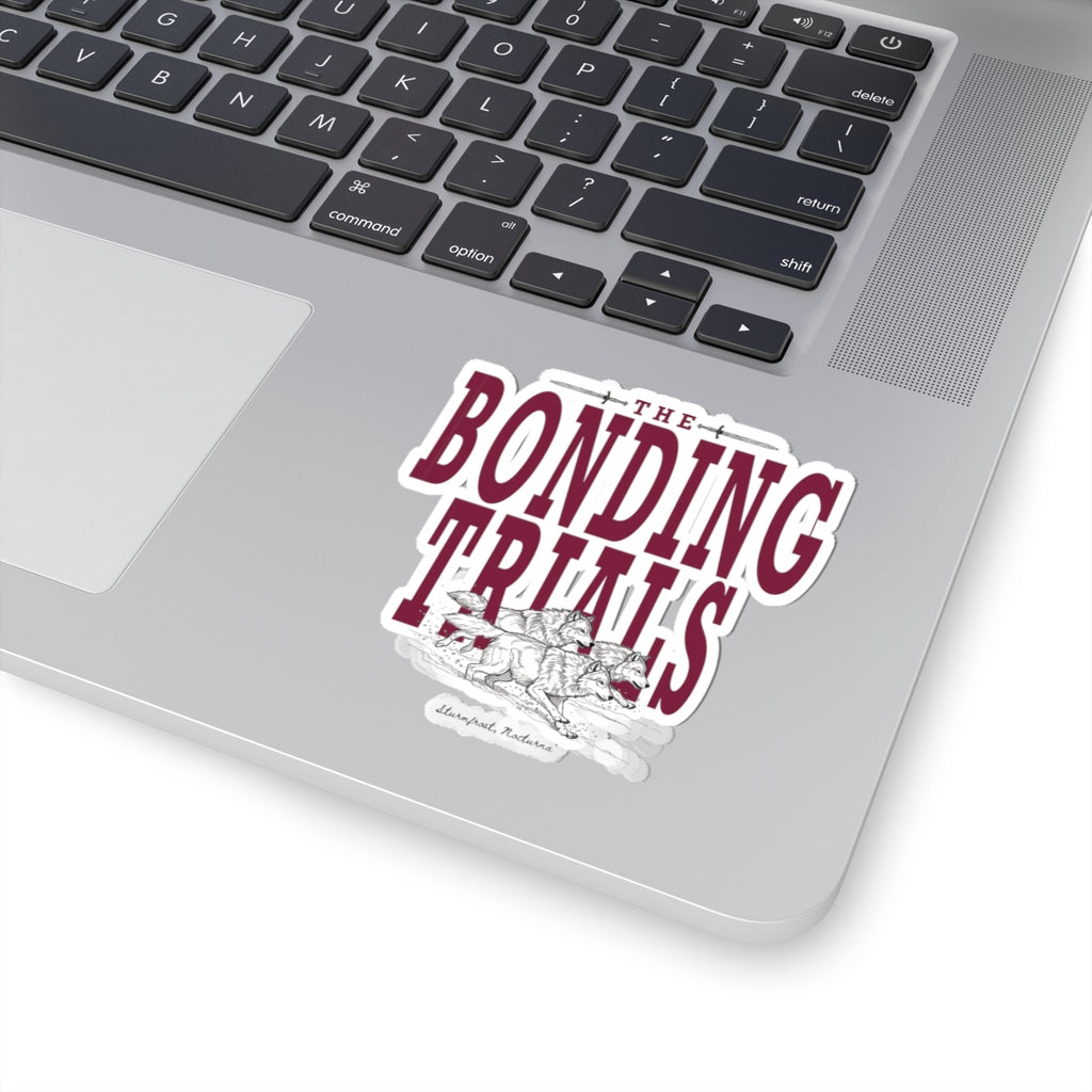 Sticker from thtgrlreads featuring Wolves of Ruin collection design with bold maroon lettering reading "The Bonding Trials" over an illustrated wolf pack, perfect for bookish fans.