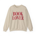 thtgrlreads cozy Comfort Colors crewneck from the Crewnecks collection featuring bold vintage puff print text "BOOK LOVER" in deep red on a soft beige, relaxed fit sweatshirt.