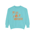 Thtgrlreads cozy oversized crewneck sweatshirt in vintage washed blue with orange vintage puff print text and stacked book graphic from the Life of a Book Bestie collection.