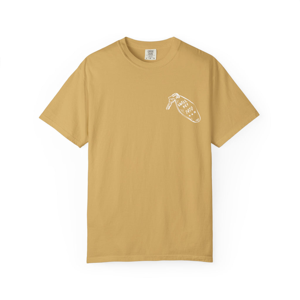 A vintage wash Comfort Colors graphic tee in mustard yellow from thtgrlreads, featuring a small white hand-drawn style print on the chest, part of the Tees and Hockey Romance collections.