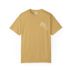 A vintage wash Comfort Colors graphic tee in mustard yellow from thtgrlreads, featuring a small white hand-drawn style print on the chest, part of the Tees and Hockey Romance collections.