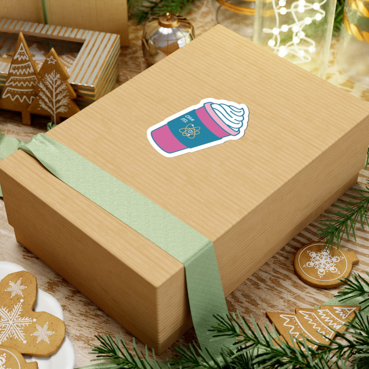 Olive coffee cup kiss cut vinyl sticker on a wrapped gift box with festive greenery from Thtgrlreads Ali Hazelwood sticker collection inspired by The Love Hypothesis