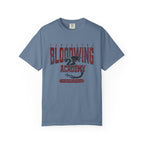 Bloodwing Academy comfort colors graphic tee by thtgrlreads featuring vintage wash soft blue fabric with bold red gothic text and a detailed dragon illustration in the center, part of the Bloodwing Academy and Back to School collections.