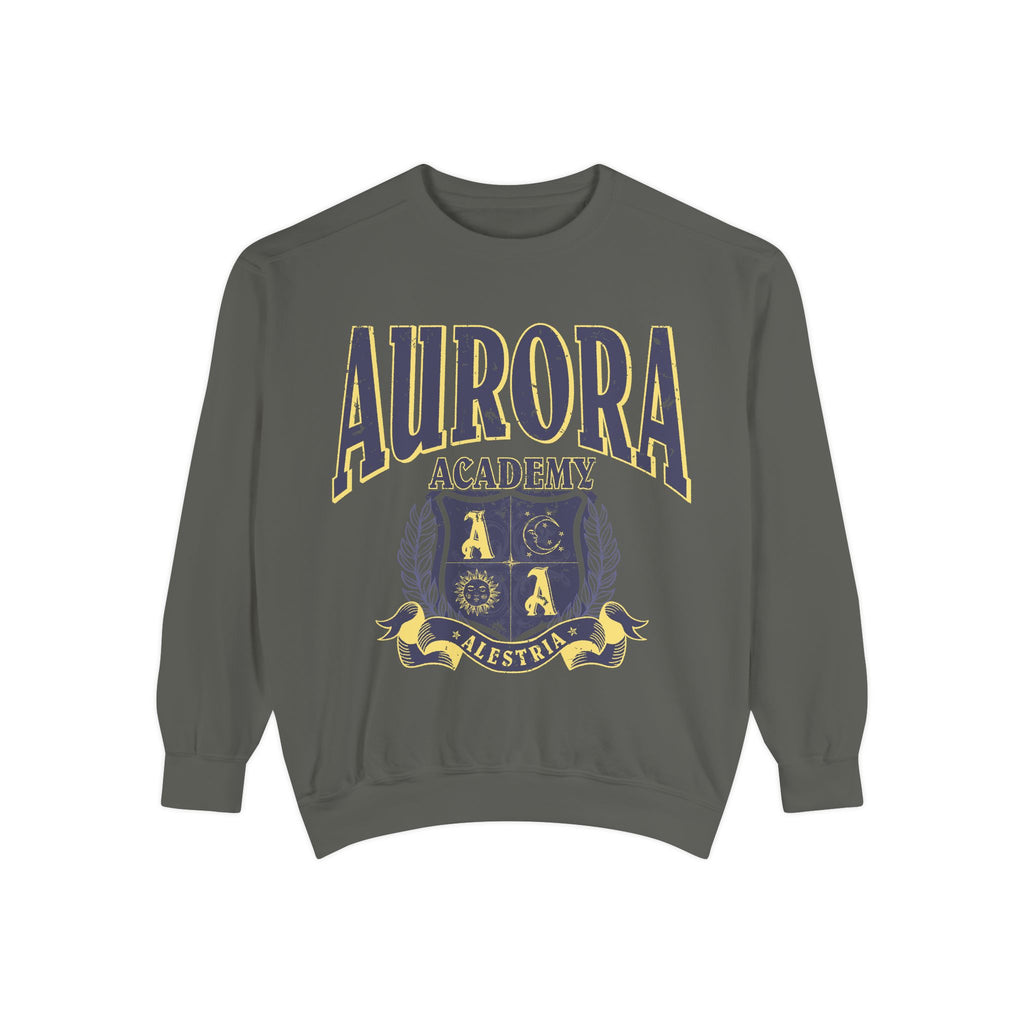Bloodwing Academy merchandise from thtgrlreads featuring a vintage wash Comfort Colors crewneck sweatshirt with a bold yellow and purple Aurora Academy crest graphic and collegiate-style text.
