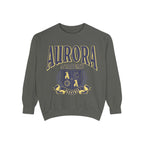 Bloodwing Academy merchandise from thtgrlreads featuring a vintage wash Comfort Colors crewneck sweatshirt with a bold yellow and purple Aurora Academy crest graphic and collegiate-style text.
