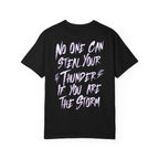 thtgrlreads black Comfort Colors graphic tee featuring a bold white and purple text design that reads "No one can steal your thunder if you are the storm" with lightning bolt accents.