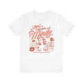 Thtgrlreads Ruthless Boys of the Zodiac collection Comfort Colors graphic tee featuring a vintage-inspired retro print with "Mindy" text and stylized female character design.