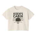 Cream Comfort Colors cropped tee featuring a Koens Cabin graphic with a woodland cabin and pine trees inspired by Ali Hazelwood MATE merch from Thtgrlreads