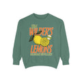 An oversized crewneck sweatshirt from thtgrlreads featuring a vintage-wash Comfort Colors base in muted green with a bold, colorful graphic of lemons and text inspired by the Darkmore Penitentiary collection.