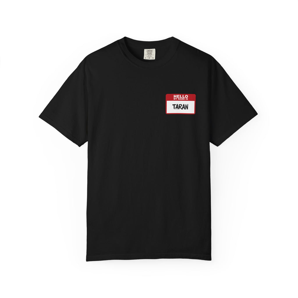 A black Comfort Colors graphic tee from thtgrlreads featuring a Kindred's Curse Saga-inspired red and white "Hello My Name Is Taran" name tag graphic on the chest.