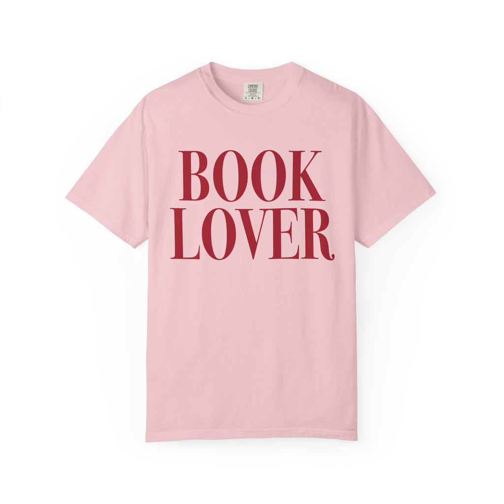 Comfort Colors vintage-washed pink graphic tee from thtgrlreads featuring bold red serif "BOOK LOVER" text, part of the Tees collection for bookish apparel fans.