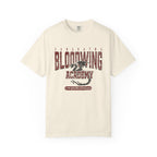 Cream Comfort Colors graphic tee from thtgrlreads featuring a vintage wash Bloodwing Academy design with a distressed dragon print, part of the Back to School and Tees collections.