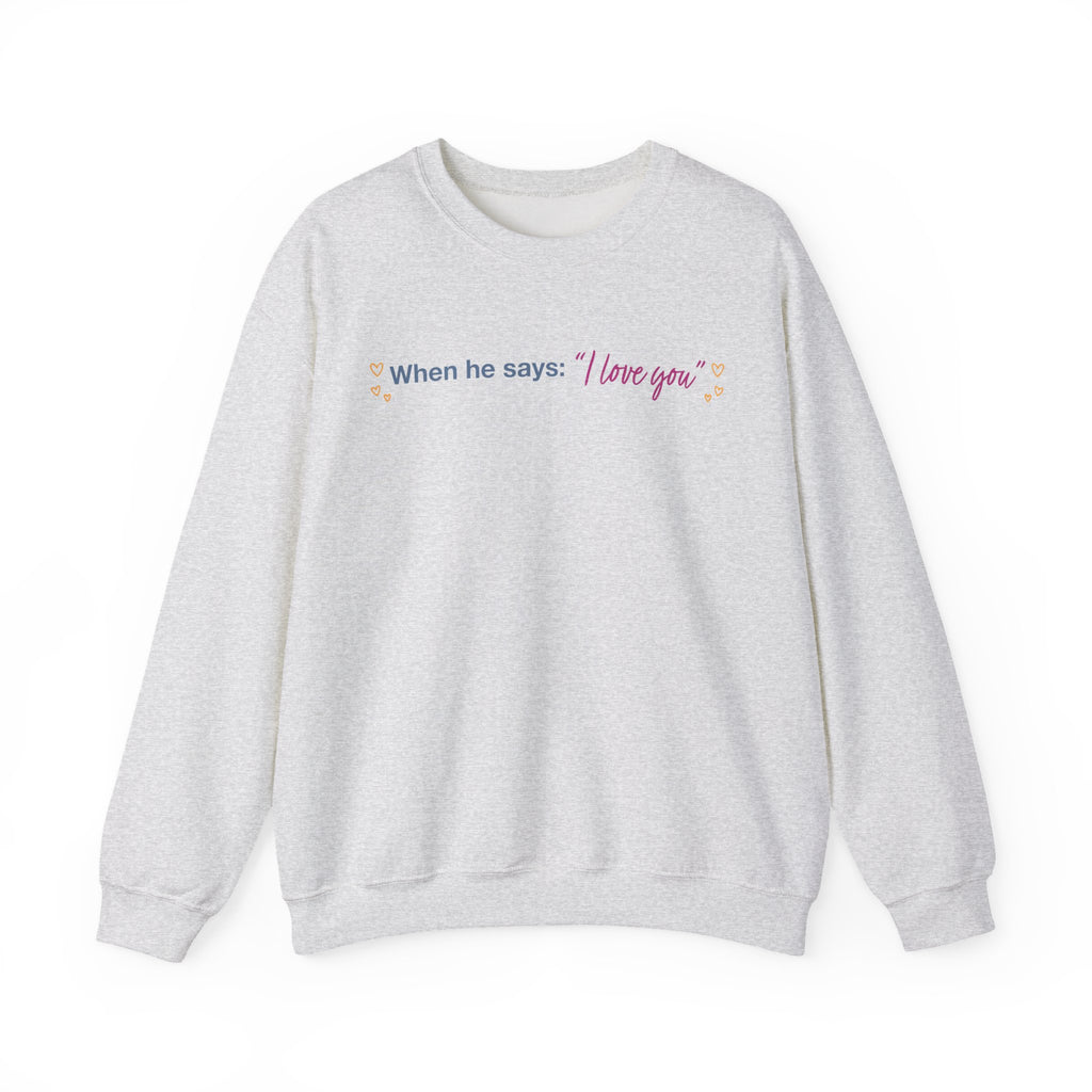 Light gray crewneck sweatshirt featuring When he says I love you in colorful lettering with heart accents, from Thtgrlreads Ali Hazelwood licensed bookish apparel