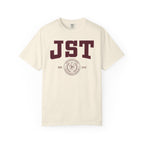 Cream Comfort Colors graphic tee featuring bold burgundy JST lettering and a circular MIT seal design, from the Ali Hazelwood Tees collection by Printify