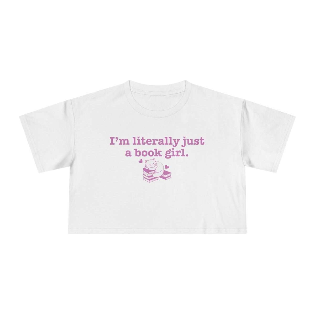 thtgrlreads officially licensed bookish apparel features this Printify white Comfort Colors crop top with vintage wash, soft fabric, and a purple graphic saying "I'm literally just a book girl" above a stack of books illustration, part of the Tees collection.