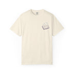 Thtgrlreads Book Bestie collection unisex Comfort Colors graphic tee in vintage cream with a small purple open book and sparkling stars print on the chest.
