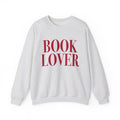 Thtgrlreads crewneck from the Crewnecks collection features a vintage-washed Comfort Colors fabric with bold red "BOOK LOVER" text printed on a cozy, unisex sweatshirt.