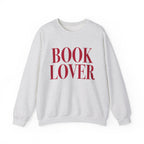 Thtgrlreads crewneck from the Crewnecks collection features a vintage-washed Comfort Colors fabric with bold red "BOOK LOVER" text printed on a cozy, unisex sweatshirt.