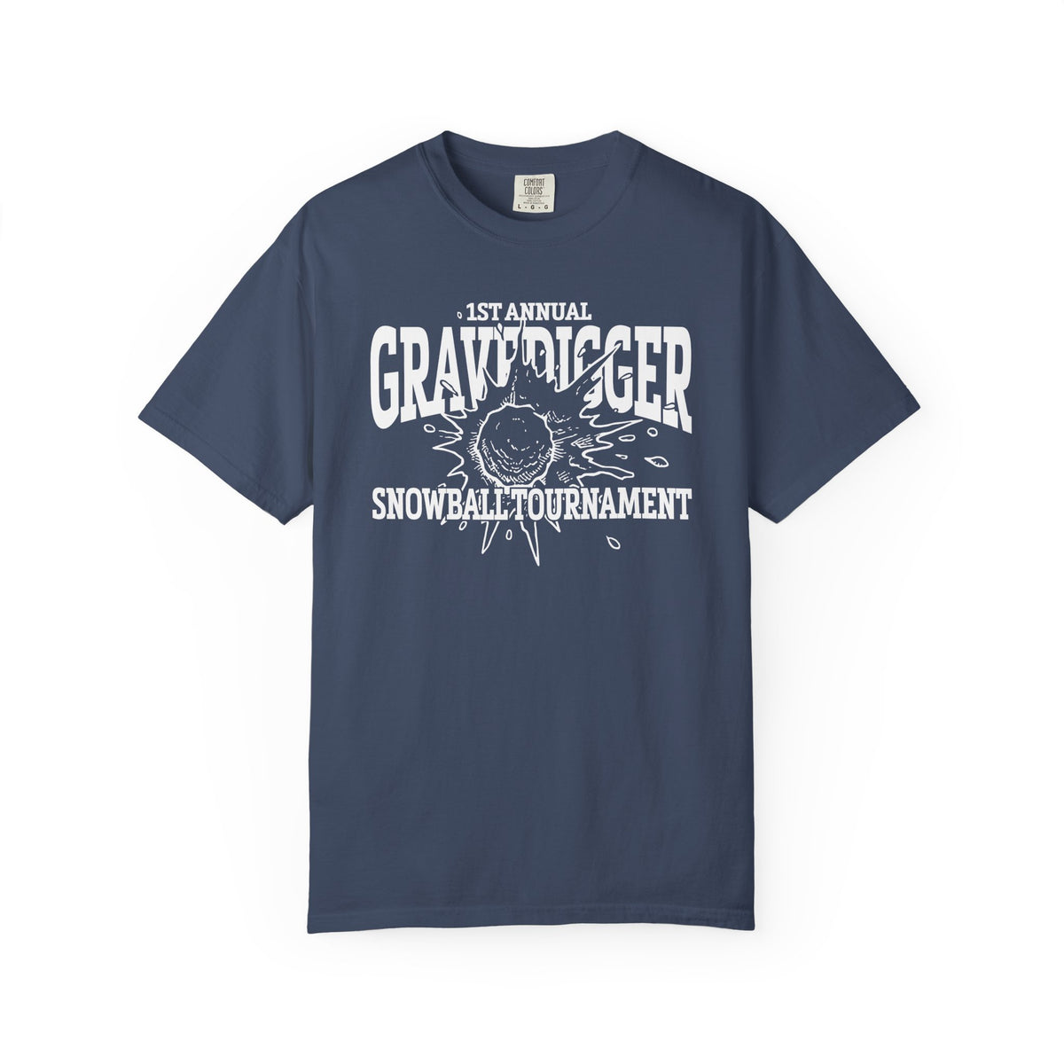 A vintage wash Comfort Colors graphic tee from thtgrlreads featuring a bold white print reading "1st Annual Gravedigger Snowball Tournament" with a snowball graphic, part of the Liv Zander and Tees collections.
