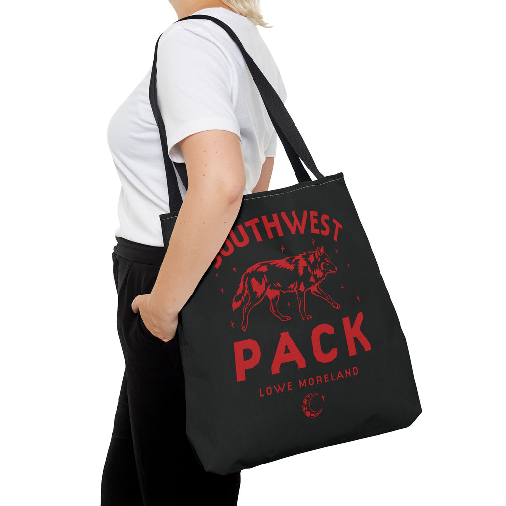 Black Southwest Pack tote bag with a red wolf graphic and bold lettering, inspired by Ali Hazelwood book merch and made for durable everyday carrying by Printify