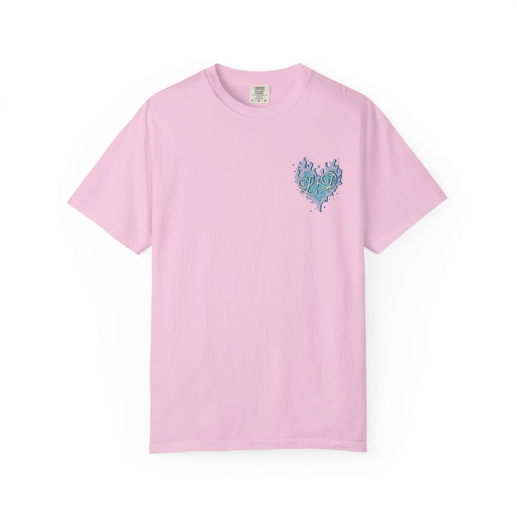 Thtgrlreads Zodiac Academy cozy Comfort Colors graphic tee in pastel pink featuring a small blue flame heart vintage puff print on chest, part of exclusive bookish apparel.