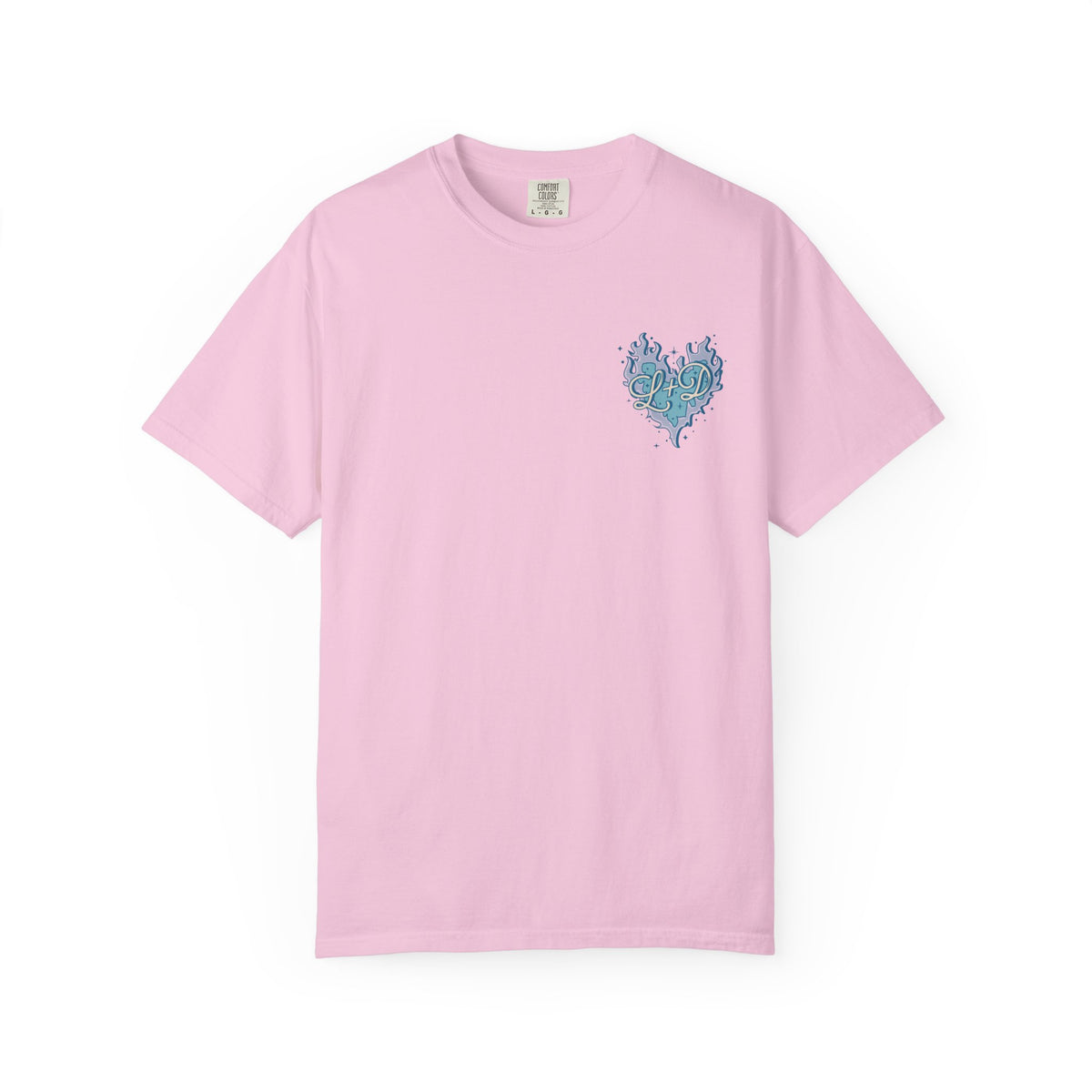 Thtgrlreads Zodiac Academy cozy Comfort Colors graphic tee in pastel pink featuring a small blue flame heart vintage puff print on chest, part of exclusive bookish apparel.