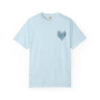 thtgrlreads light blue Comfort Colors graphic tee featuring a small, intricate heart-shaped design with swirling botanical elements in teal and navy tones on the chest, offering a vintage wash and relaxed unisex fit.