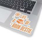 Sticker from thtgrlreads' The Life of a Book Bestie collection featuring vintage orange text and stacked books graphic on a white background, placed on a laptop corner.