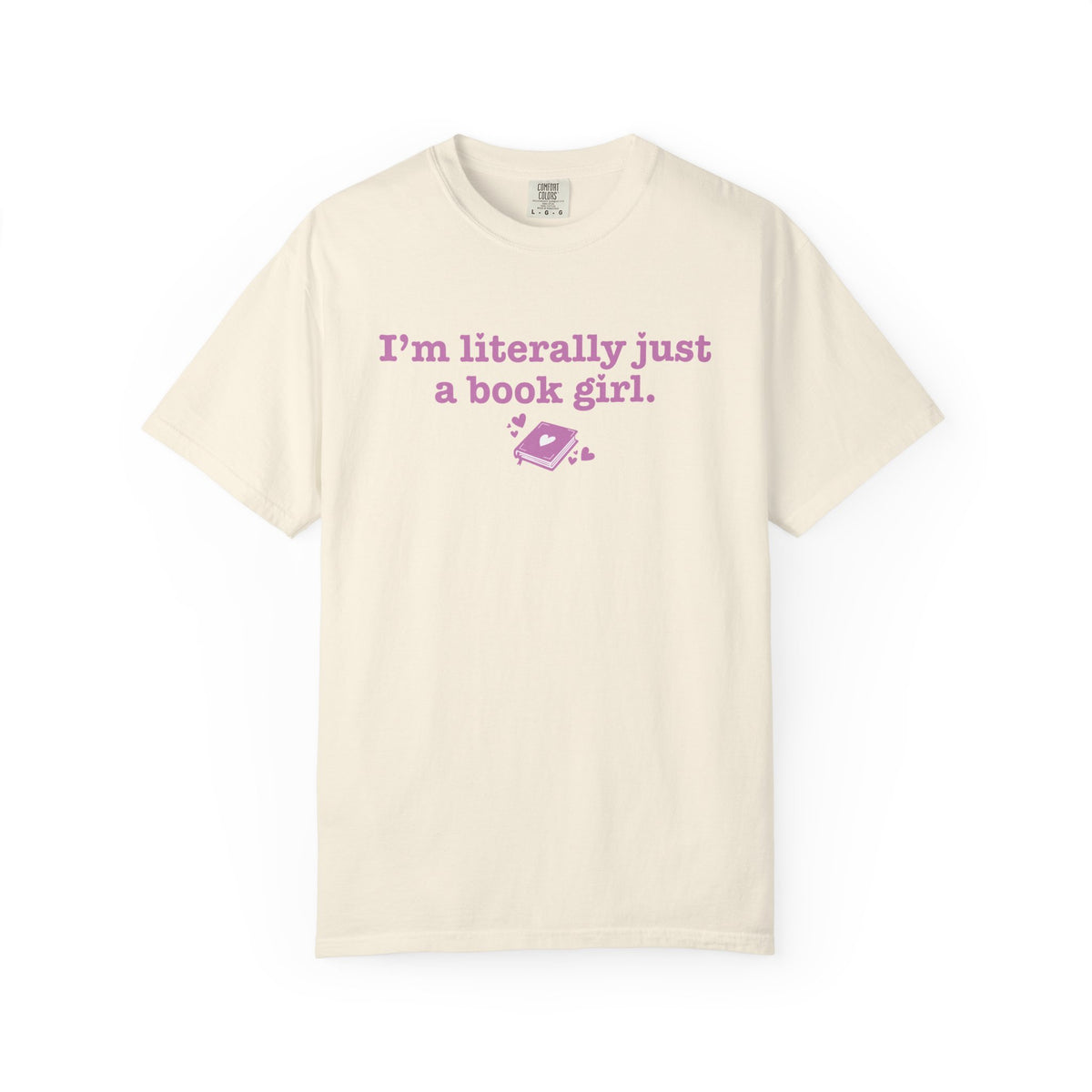 thtgrlreads Book Bestie collection cream Comfort Colors graphic tee with vintage wash, featuring pink printed text "I'm literally just a book girl" and a small book graphic.