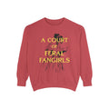 Off Brand oversized crewneck sweatshirt by thtgrlreads featuring vintage wash Comfort Colors fabric and a bold yellow graphic text reading "A Court of Feral Fangirls" with a sketch-style illustration, perfect for Book Bestie fans.