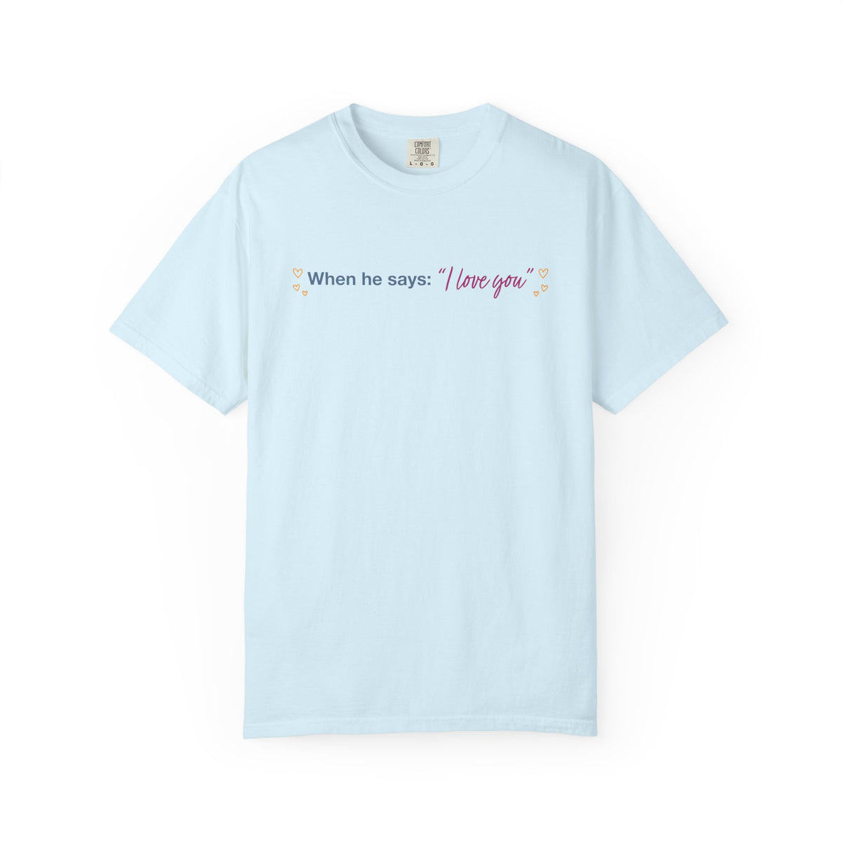 Light blue Comfort Colors tee featuring the phrase When he says I love you with floral accents, an officially licensed Ali Hazelwood design from Thtgrlreads