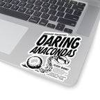 Black and white sticker on a laptop featuring bold, distressed text "Daring Anacondas" with "Darkmore Penitentiary" above, and an illustration of broken handcuffs with a chain.