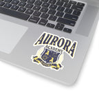 A Ruthless Boys of the Zodiac inspired Aurora Academy sticker from thtgrlreads featuring a vintage-style crest with bold text on a laptop surface, perfect for fans and bookish collectors.