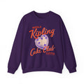 Ruthless Boys of the Zodiac collection oversized crewneck sweatshirt by thtgrlreads featuring vintage wash purple fabric with bold orange "Middle Kipling Cake Club" text and heart graphic in layered print style.