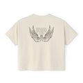 Liv Zander collection crop top from thtgrlreads featuring vintage-washed cream Comfort Colors fabric with detailed black wing illustration and poetic text in a romantic fantasy style.