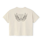 Liv Zander collection crop top from thtgrlreads featuring vintage-washed cream Comfort Colors fabric with detailed black wing illustration and poetic text in a romantic fantasy style.