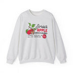 Kindred's Curse Saga crewneck by thtgrlreads featuring a vintage-washed, light gray Comfort Colors oversized sweatshirt with a colorful apple orchard graphic and bold text.
