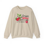 thtgrlreads oversized crewneck sweatshirt featuring a vintage-style graphic of a branch with apples and text referencing Sorae’s Apple Orchard in Emarion, printed on a soft cream Comfort Colors base.